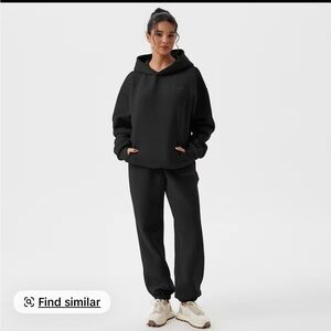 OQQ black sweatsuit size small. Brand new.